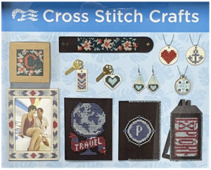 A collection of cross stitch crafts framed under glass
